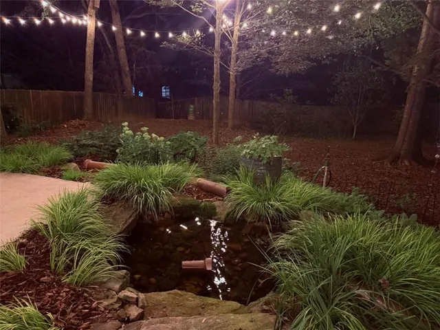 a backyard of a house with lots of green space