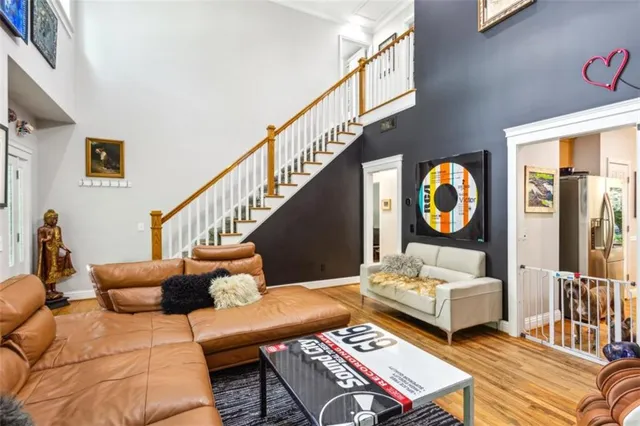 a living room with furniture and a mirror
