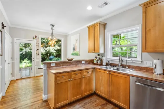 a kitchen with a sink stove and cabinets