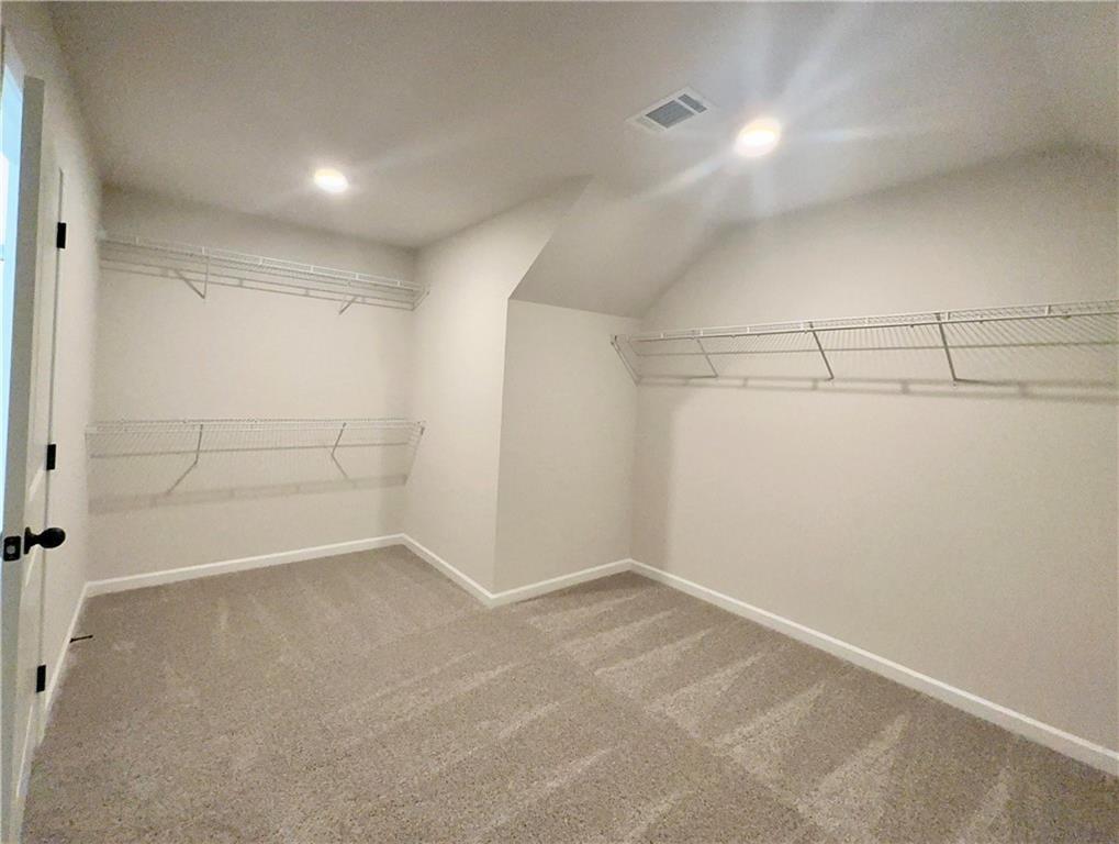 306 Rodeo Drive Auburn, GA 30011 - Photo 22 of 23 a view of a room with racks on the wall