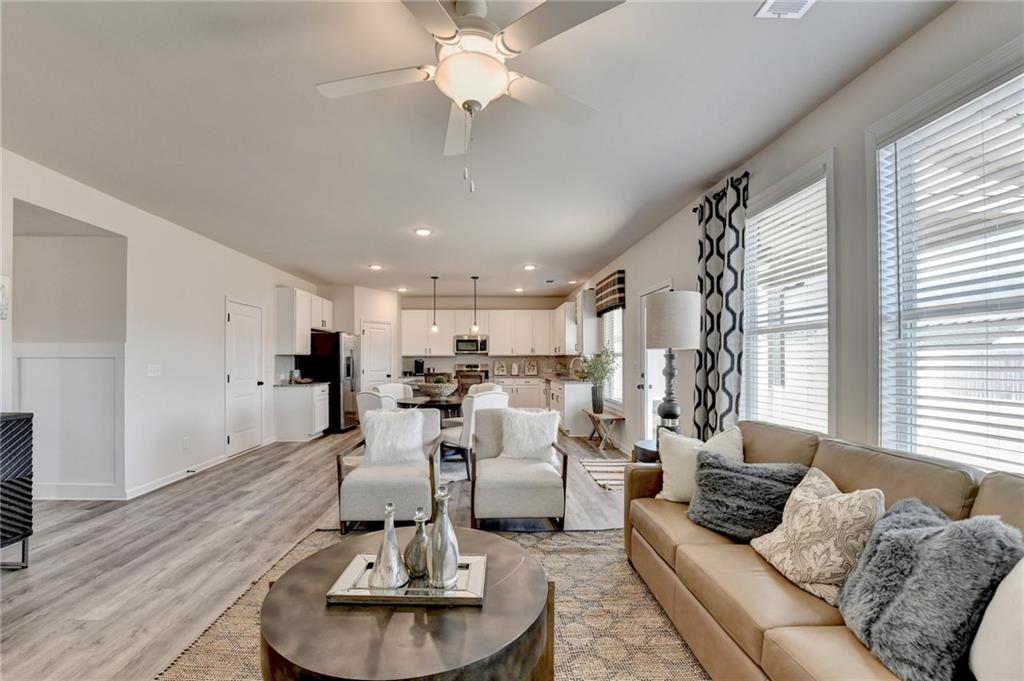306 Rodeo Drive Auburn, GA 30011 - Photo 23 of 86 a living room with furniture and a large window