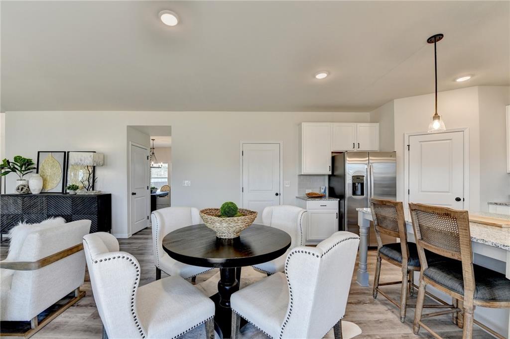 306 Rodeo Drive Auburn, GA 30011 - Photo 29 of 86 a view of a dining room with furniture and wooden floor