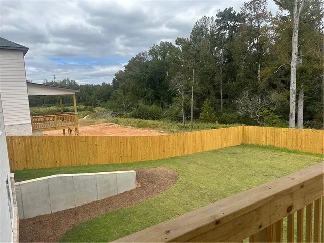 a view of swimming pool with a yard