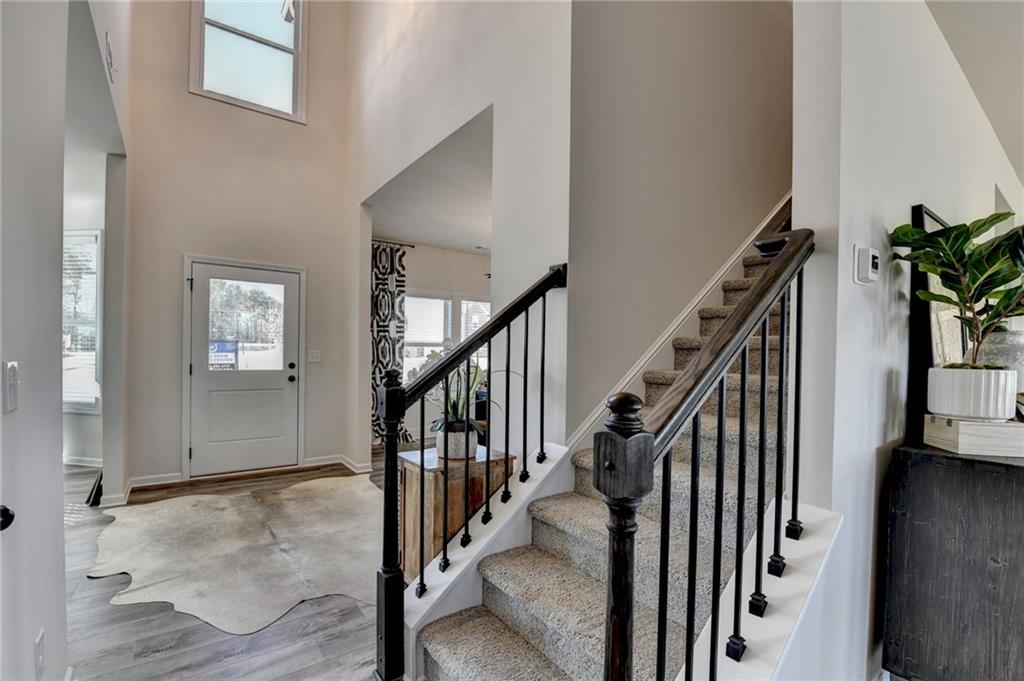 306 Rodeo Drive Auburn, GA 30011 - Photo 41 of 86 a view of an entryway with wooden floor and stairs