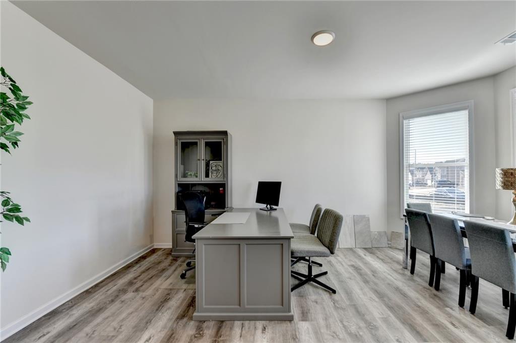 306 Rodeo Drive Auburn, GA 30011 - Photo 10 of 86 a view of a workspace with furniture and a window
