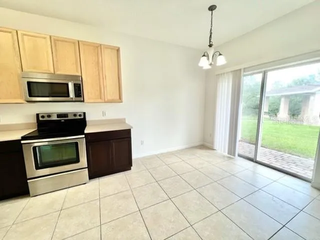 a view of a kitchen with dishwasher cabinet and microwave