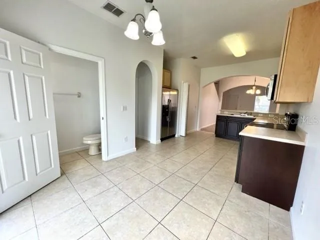 a view of a kitchen counter space and wooden floor