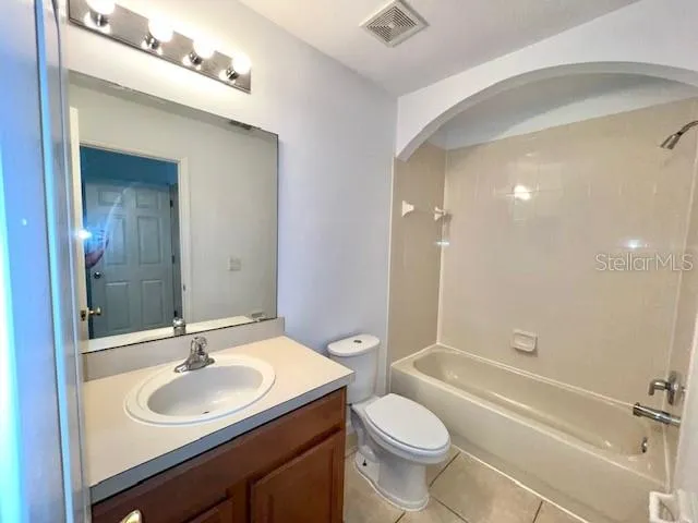 a bathroom with a sink toilet tub and shower