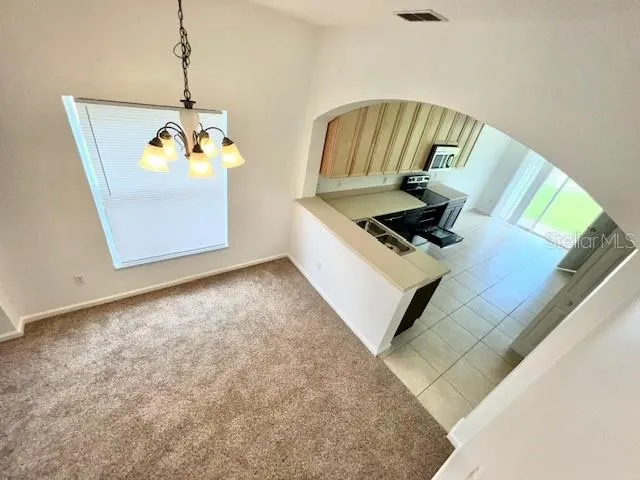 a view of kitchen and microwave