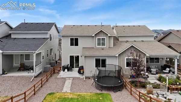 a front view of house with yard and outdoor seating