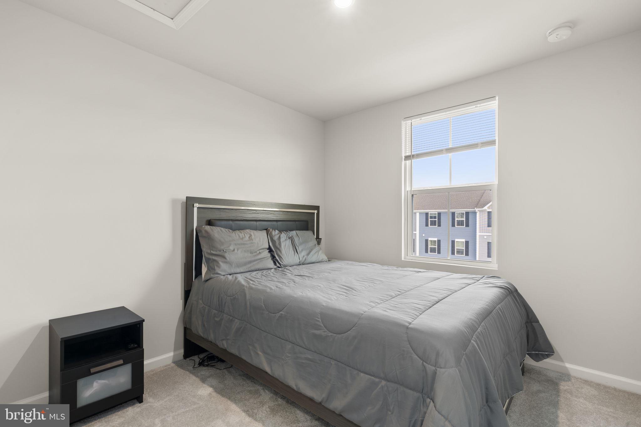 25 Wendowski Street Beverly, NJ 08010 - Photo 24 of 29 a bedroom with a bed and a window