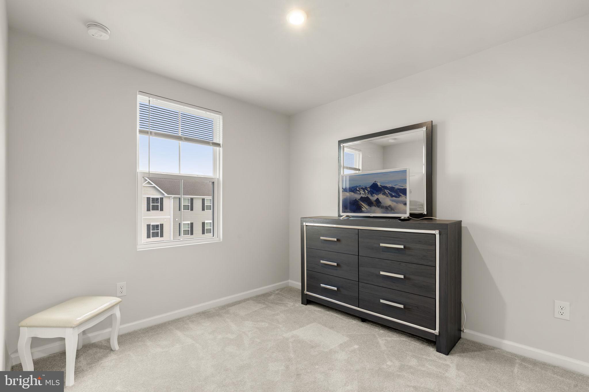 25 Wendowski Street Beverly, NJ 08010 - Photo 25 of 29 a room with a dresser and a window