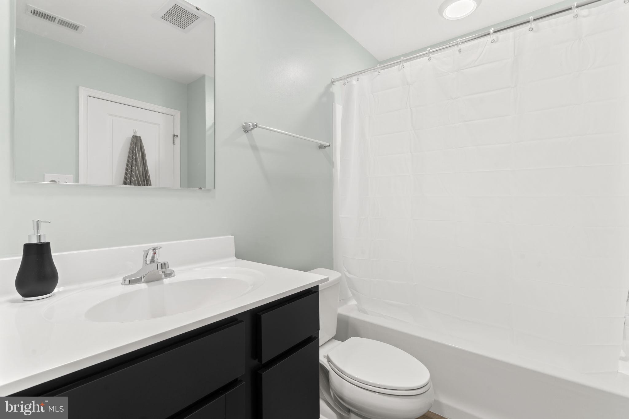 25 Wendowski Street Beverly, NJ 08010 - Photo 26 of 29 a bathroom with a sink a toilet and shower