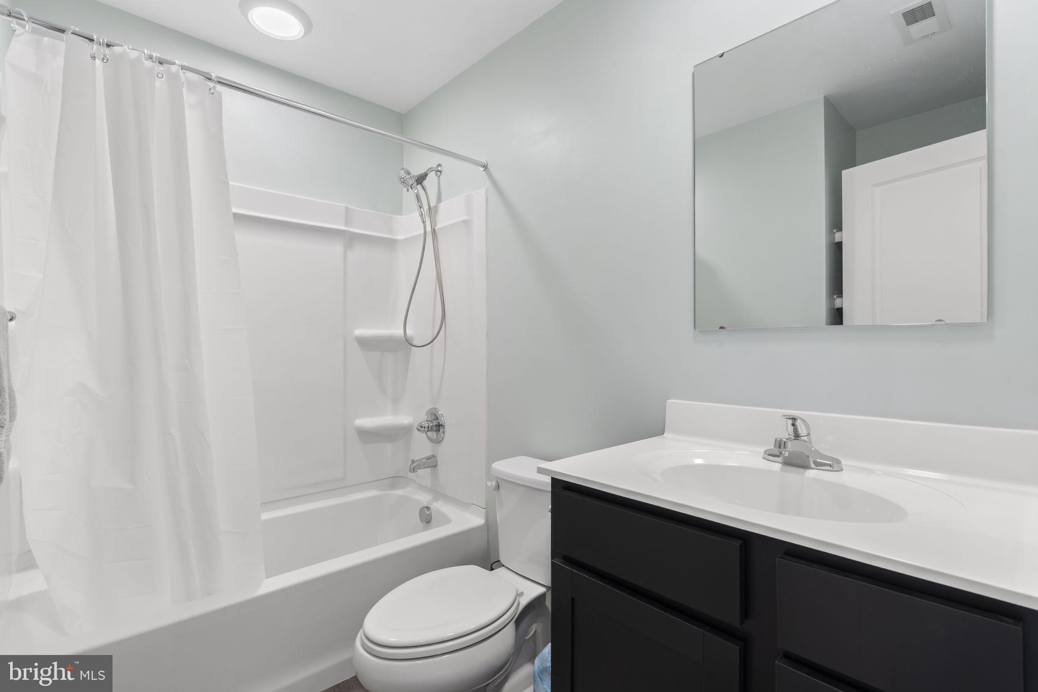 25 Wendowski Street Beverly, NJ 08010 - Photo 27 of 29 a bathroom with a sink a toilet and shower