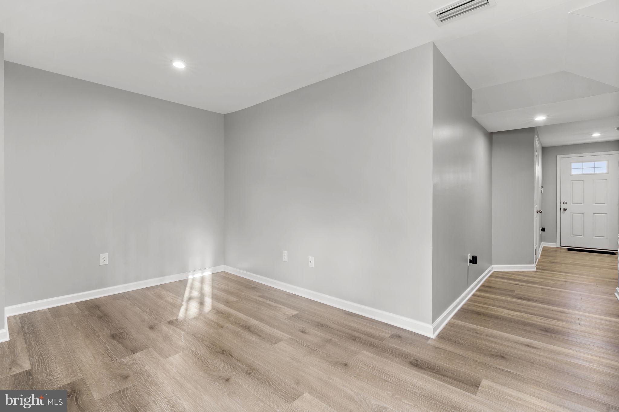 25 Wendowski Street Beverly, NJ 08010 - Photo 5 of 29 a view of an empty room with wooden floor