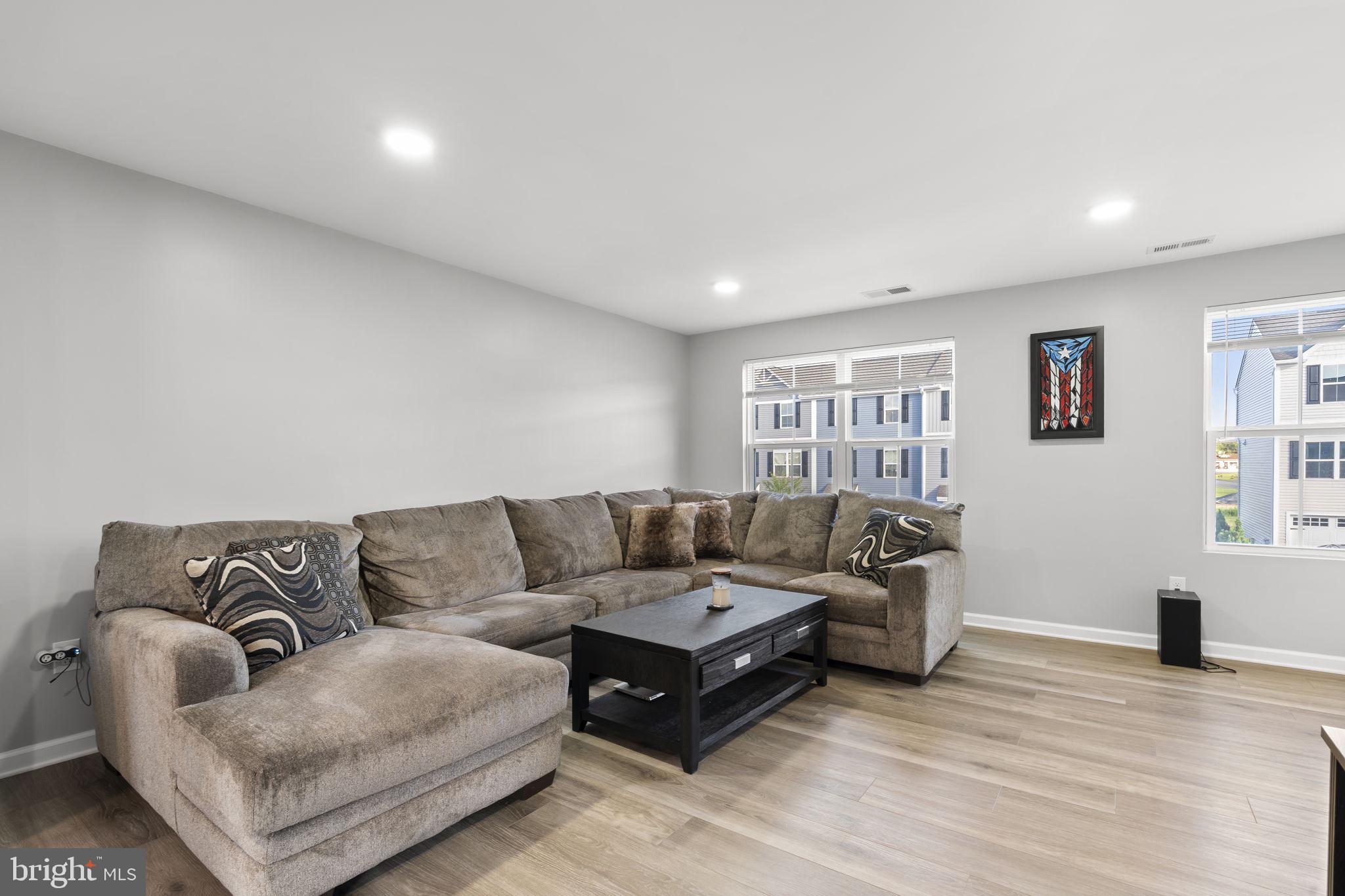 25 Wendowski Street Beverly, NJ 08010 - Photo 7 of 29 a living room with furniture and a window