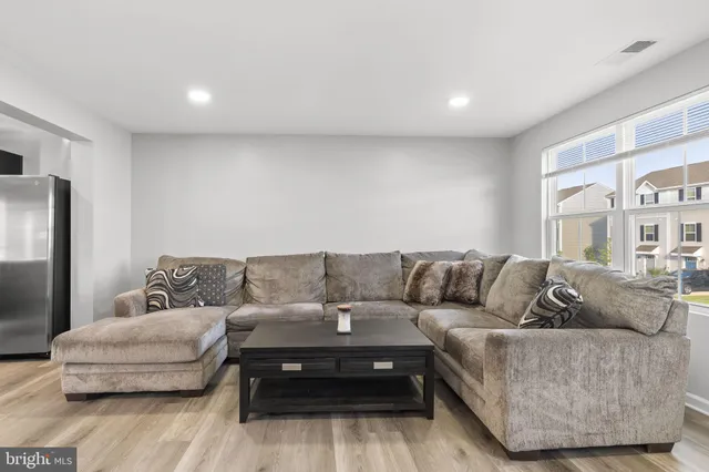 a living room with furniture and a couch