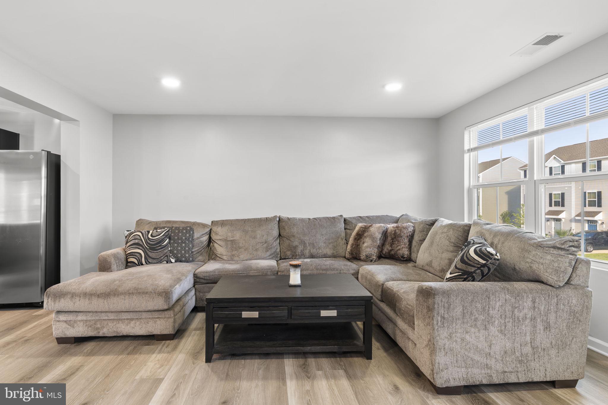 25 Wendowski Street Beverly, NJ 08010 - Photo 9 of 29 a living room with furniture and a couch