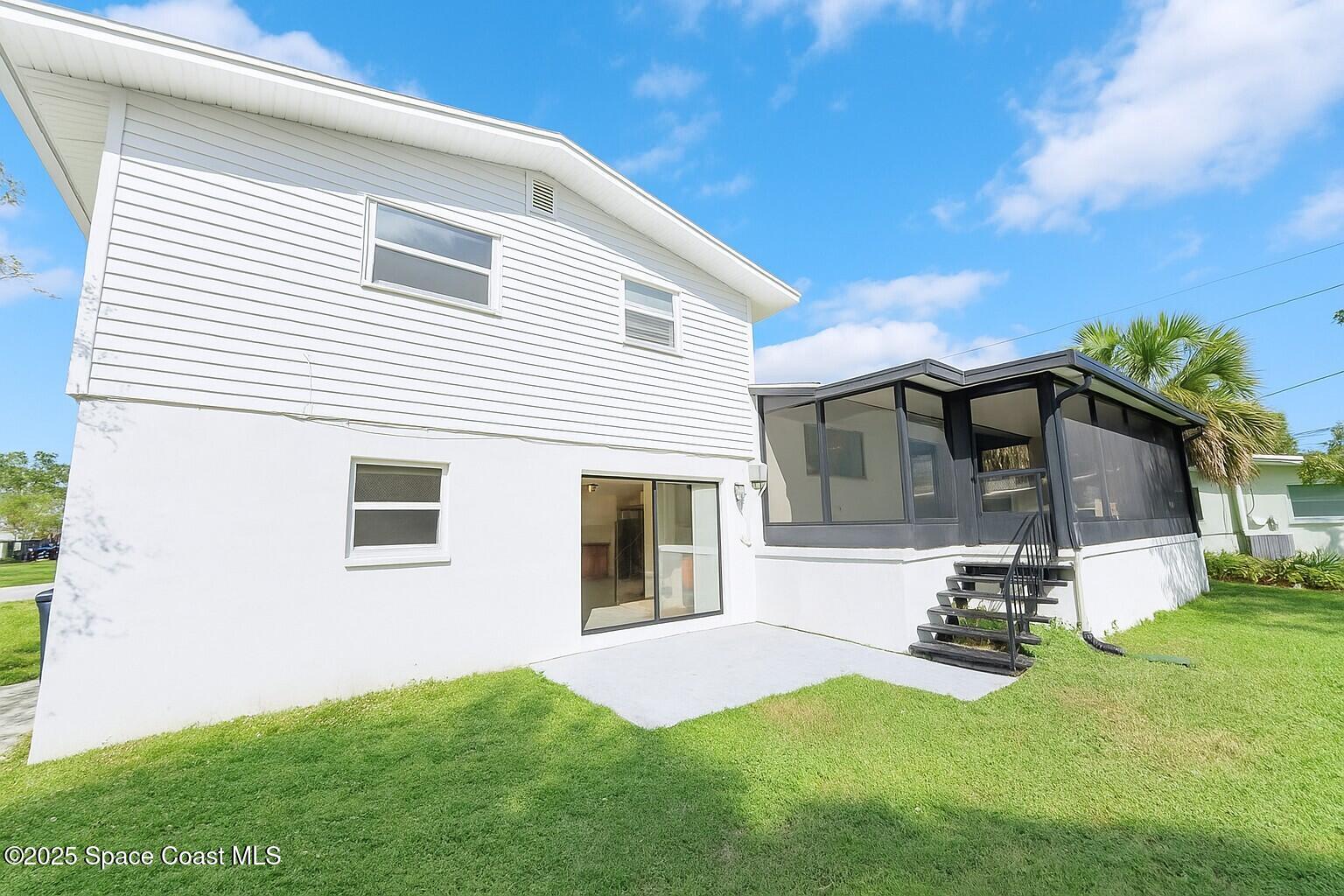 1021 Palmer Road Rockledge, FL 32955 - Photo 20 of 23 a view of a backyard with a sitting area