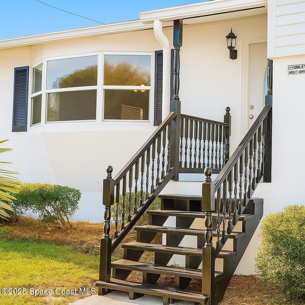 1021 Palmer Road Rockledge, FL 32955 - Photo 2 of 23 a view of entryway with wooden floor
