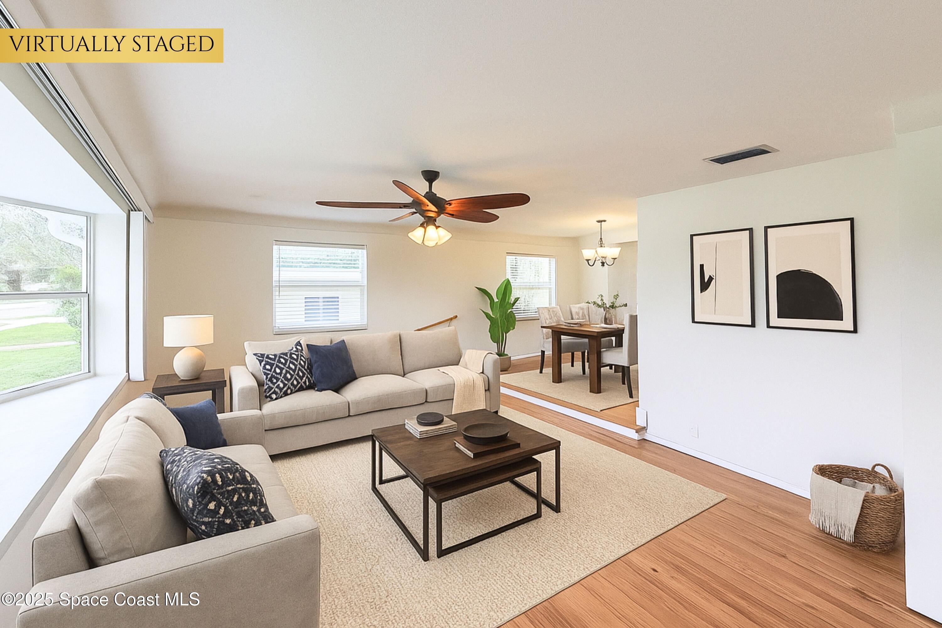 1021 Palmer Road Rockledge, FL 32955 - Photo 4 of 23 a living room with furniture and a wooden floor