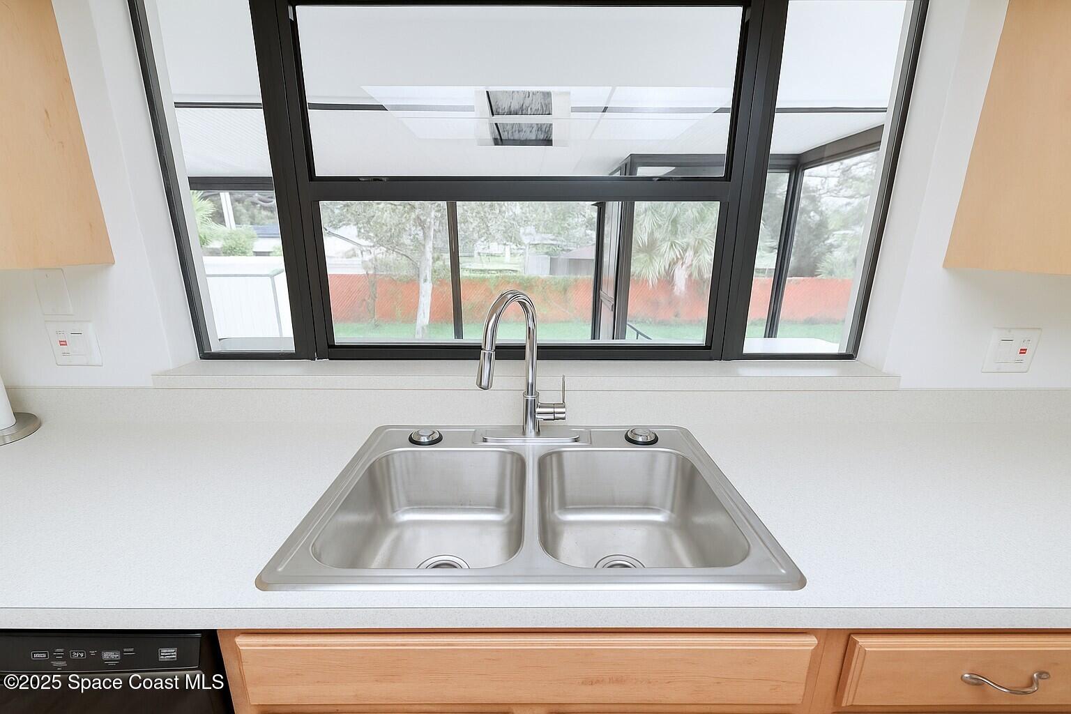 1021 Palmer Road Rockledge, FL 32955 - Photo 8 of 23 a close view of sink and tap