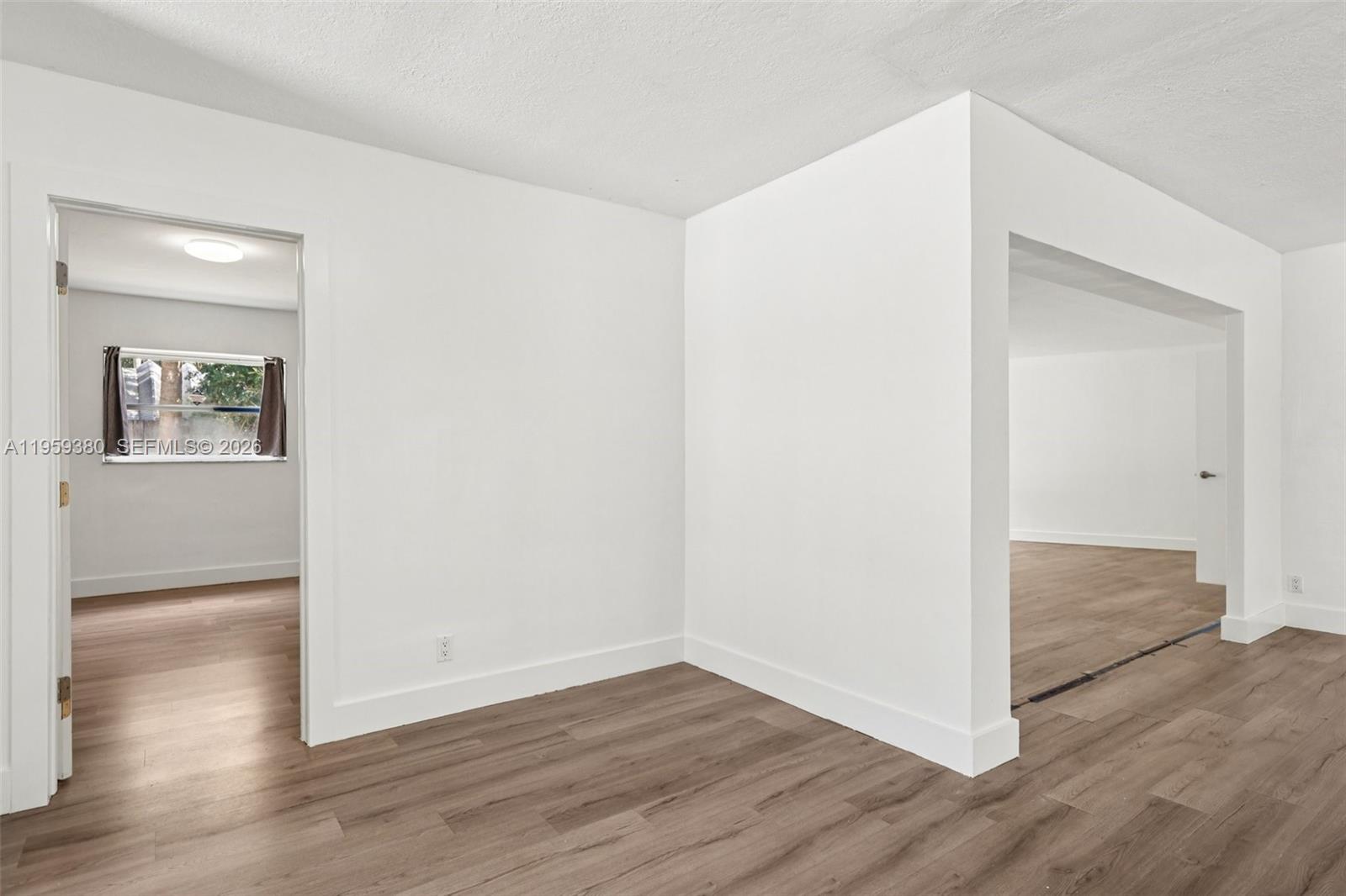 2720 Northeast 25th Terrace Boca Raton, FL 33431 - Photo 15 of 40 wooden floor in an empty room
