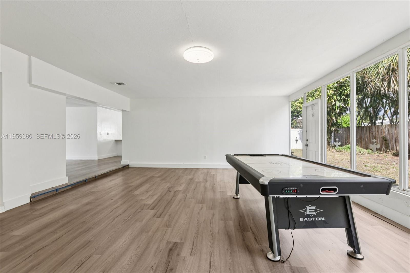 2720 Northeast 25th Terrace Boca Raton, FL 33431 - Photo 24 of 40 a view of a dining room with furniture and wooden floor