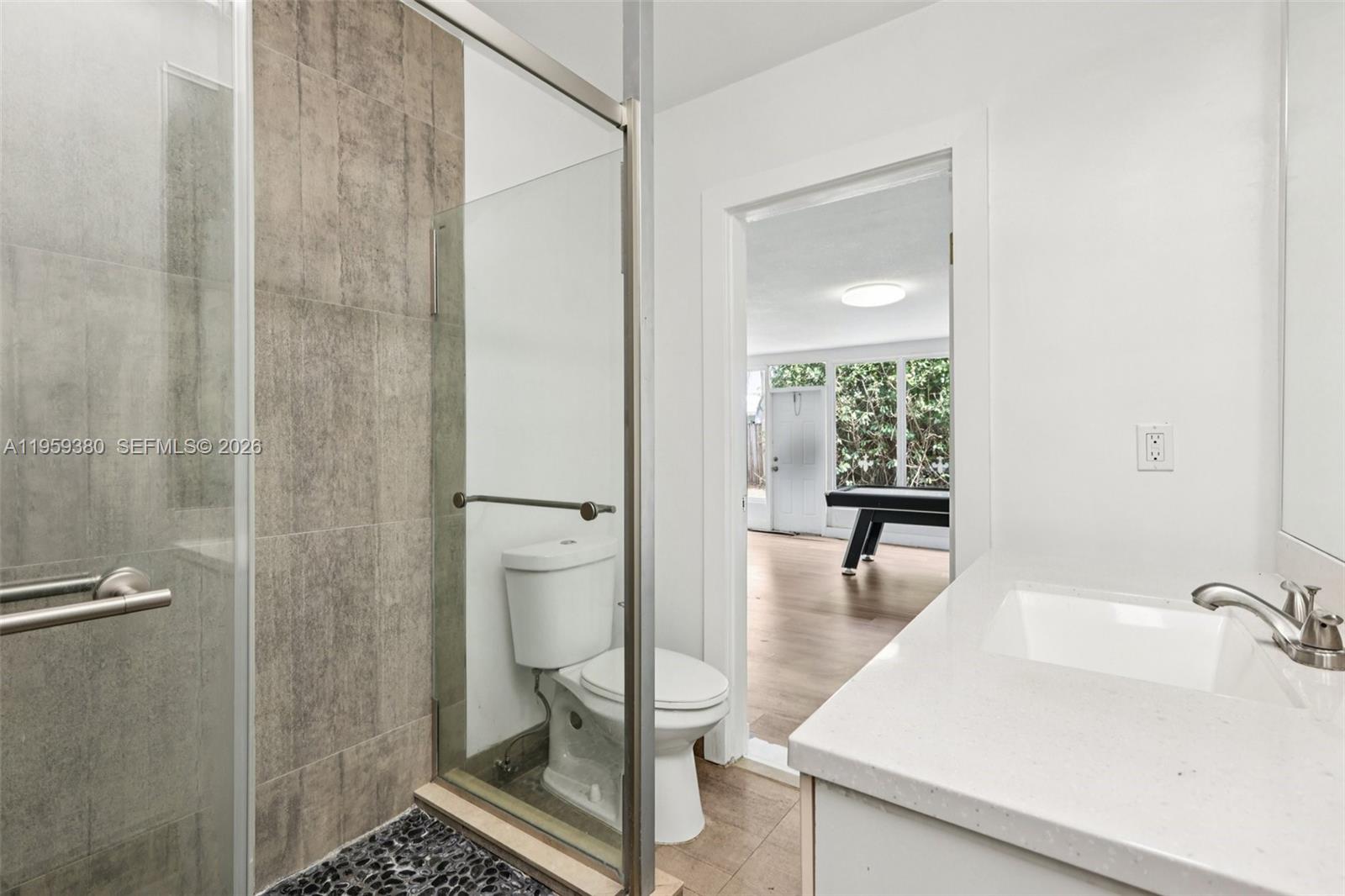 2720 Northeast 25th Terrace Boca Raton, FL 33431 - Photo 27 of 40 a bathroom with a sink and a mirror