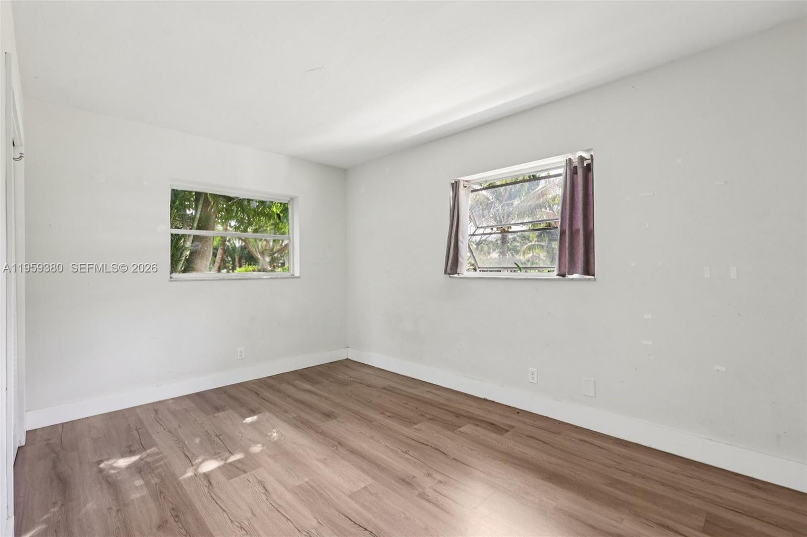 2720 Northeast 25th Terrace Boca Raton, FL 33431 - Photo 32 of 40 a view of empty room with wooden floor
