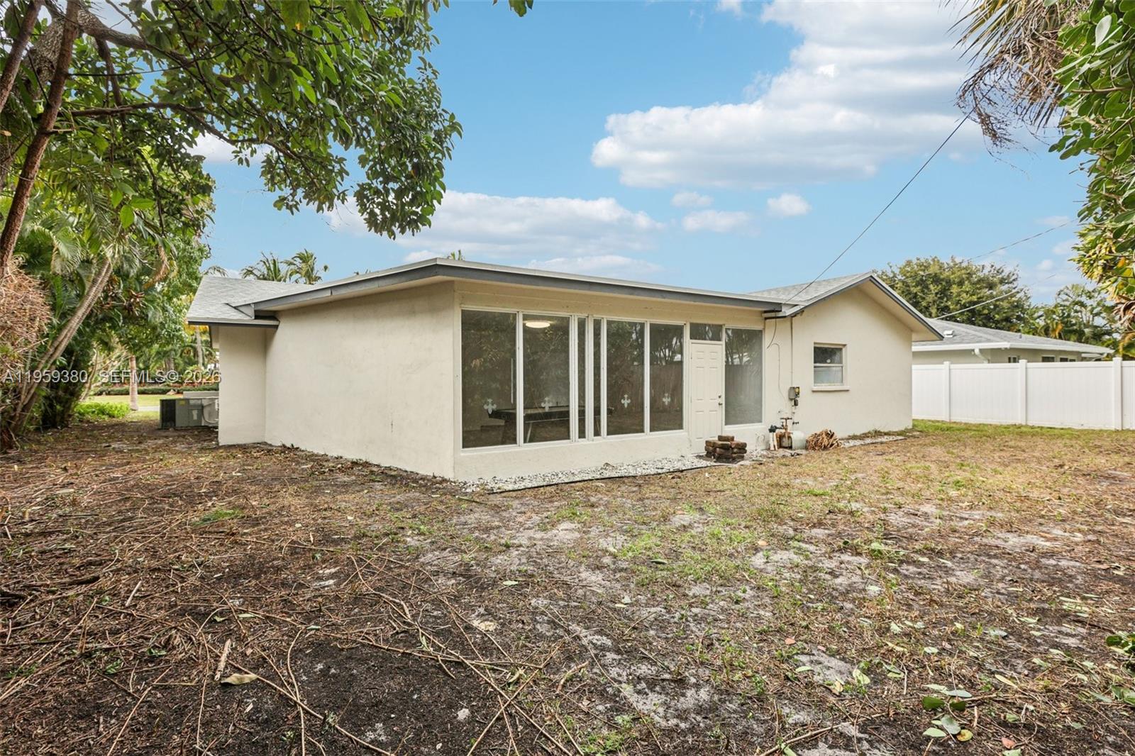 2720 Northeast 25th Terrace Boca Raton, FL 33431 - Photo 38 of 40 a house with white door