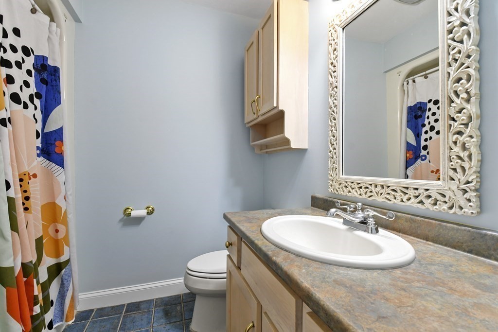 210 Rocky Road Northbridge, MA 01588 - Photo 30 of 37 a bathroom with a sink and a mirror with toilet