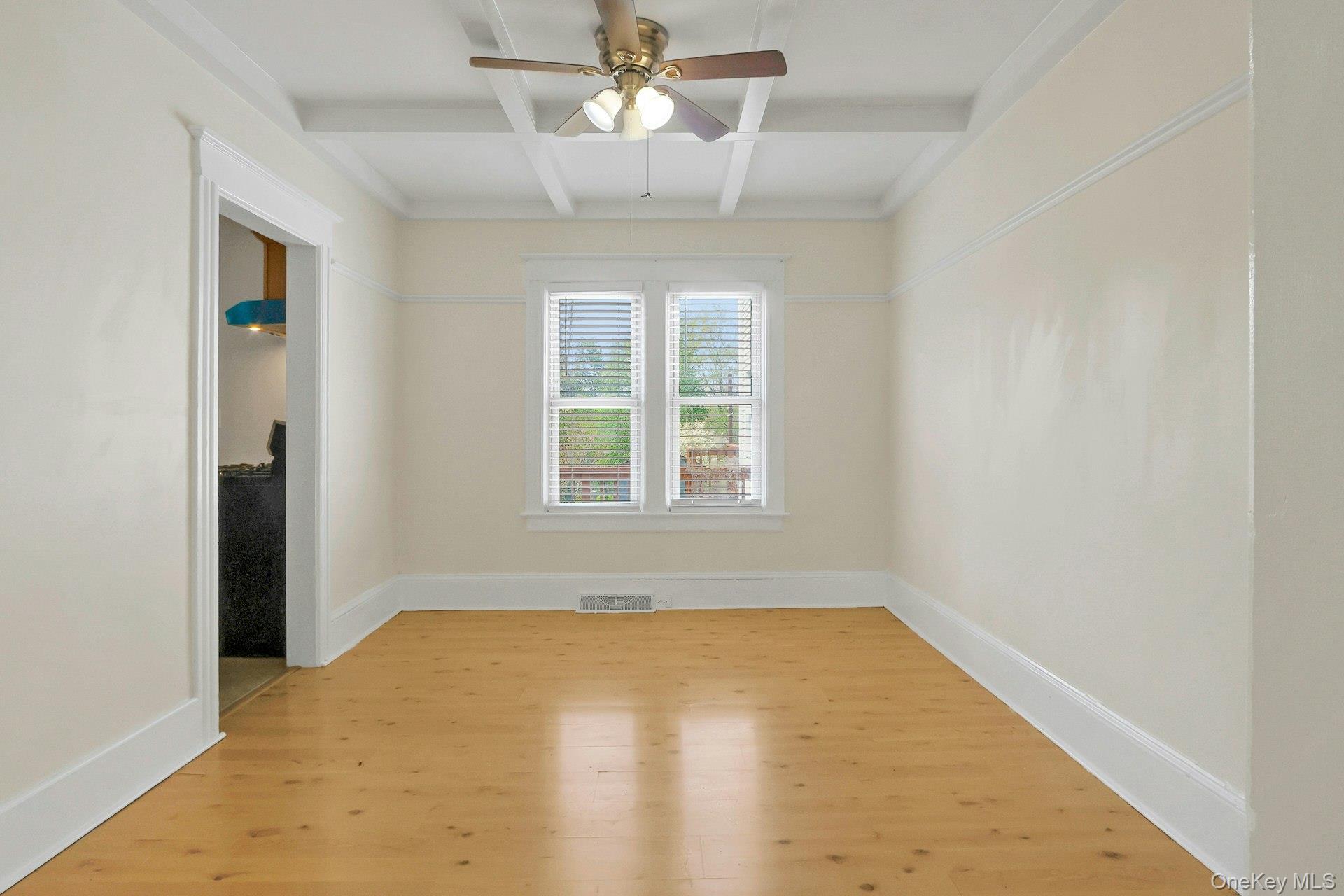 24 Firth Street, Unit 24 Cornwall, NY 12518 - Photo 8 of 30 Dining room with laminate floors and coffered ceiling