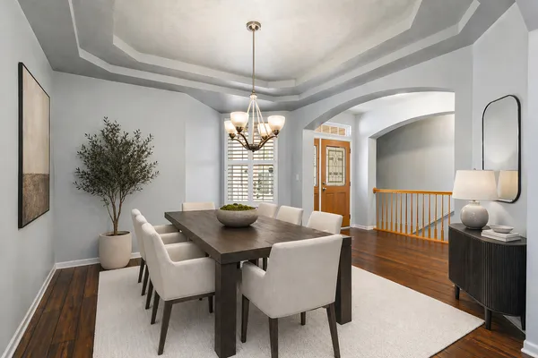 a dining room with furniture and window