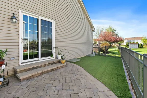 a view of a house with a backyard