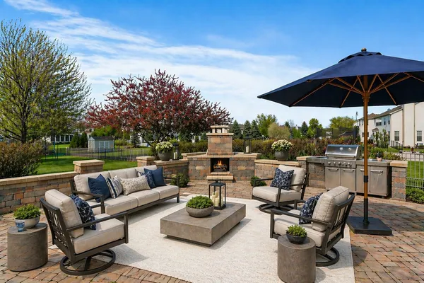 a patio with patio a couch and chairs