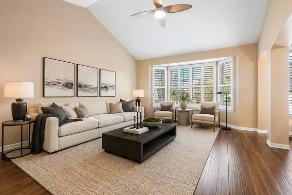 a living room with furniture and a large window