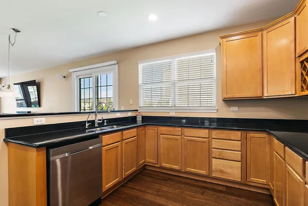a kitchen with a sink and cabinets
