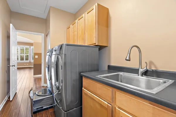 a kitchen with a refrigerator and a sink