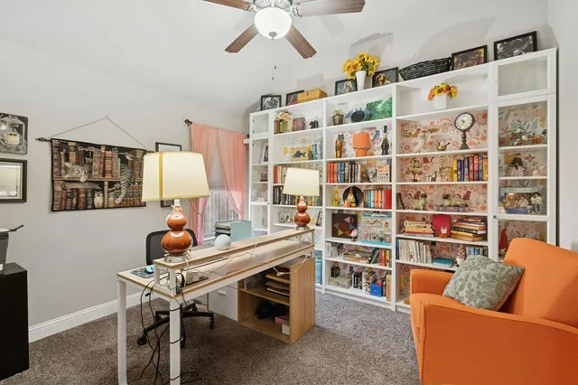 a living room with furniture cabinets and a table