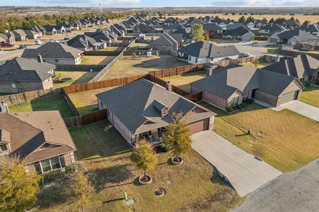 an aerial view of a house with a ocean view