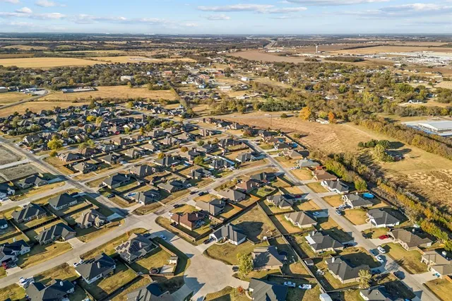an aerial view of residential building and ocean