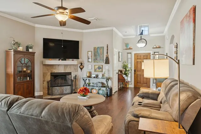 a living room with furniture fireplace and a flat screen tv