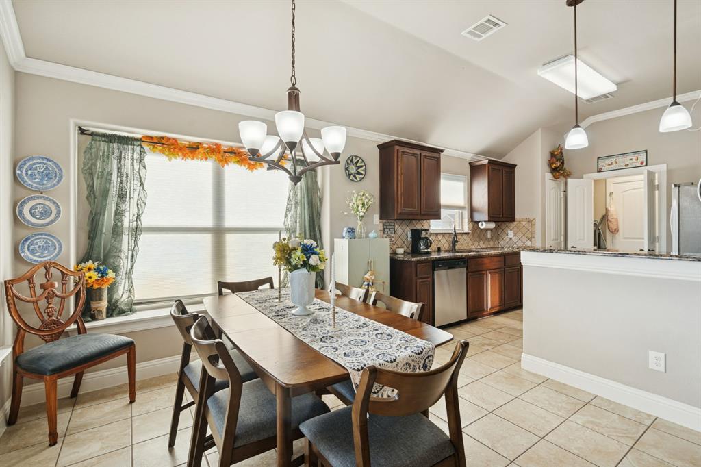 105 Cherry Point Drive Palmer, TX 75152 - Photo 9 of 32 a kitchen with a table and chairs in it