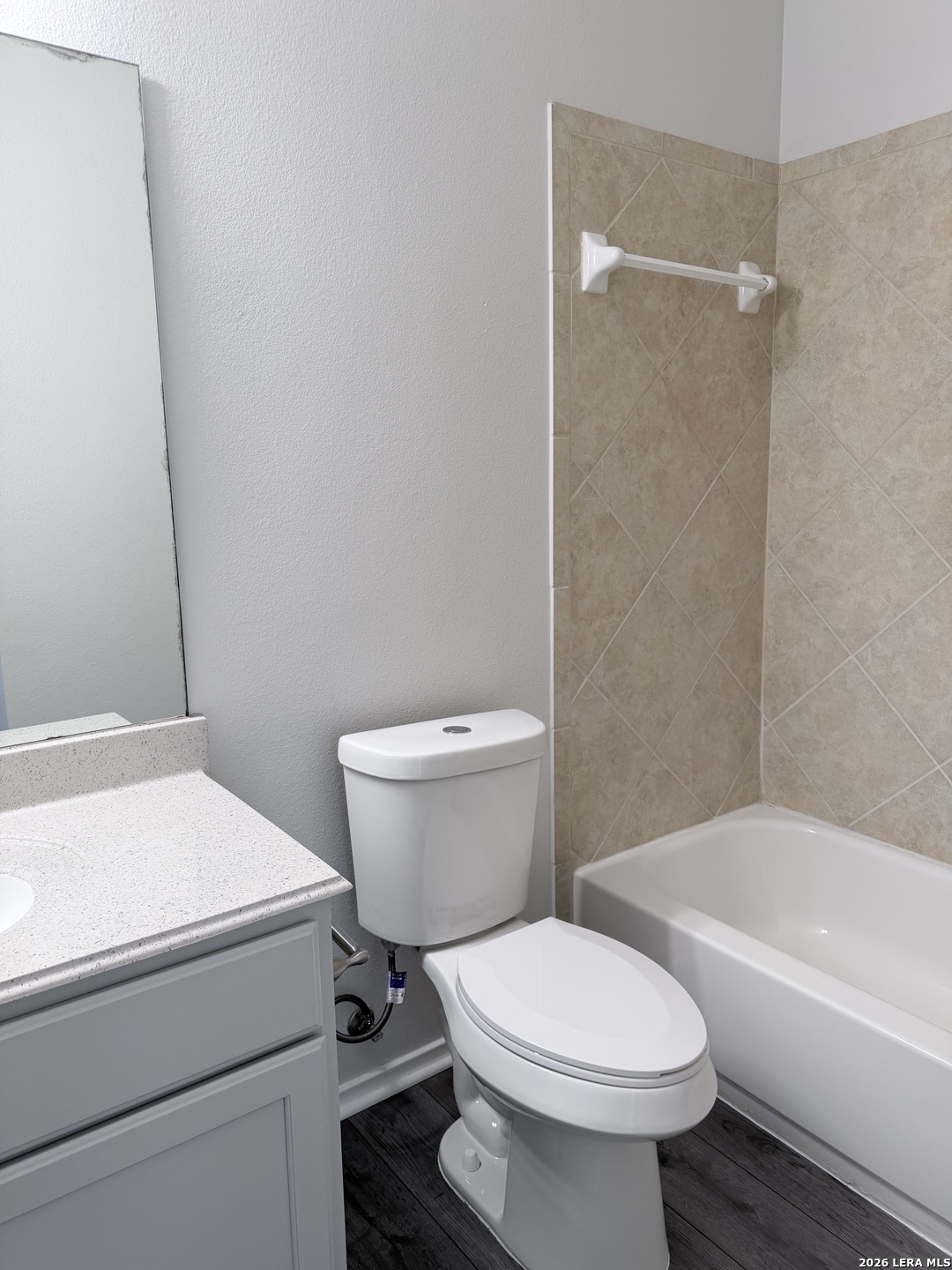 6736 Terra Rye San Antonio, TX 78240 - Photo 12 of 26 a white toilet sitting next to a bath tub