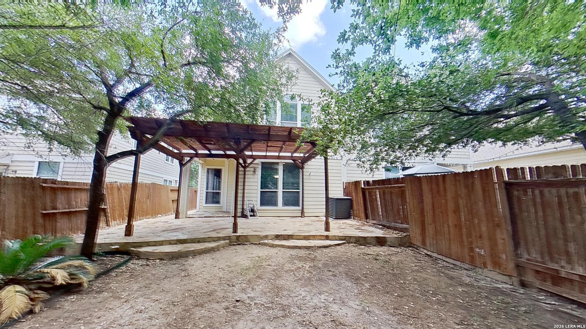 6736 Terra Rye San Antonio, TX 78240 - Photo 25 of 26 a backyard of a house with barbeque oven and tree