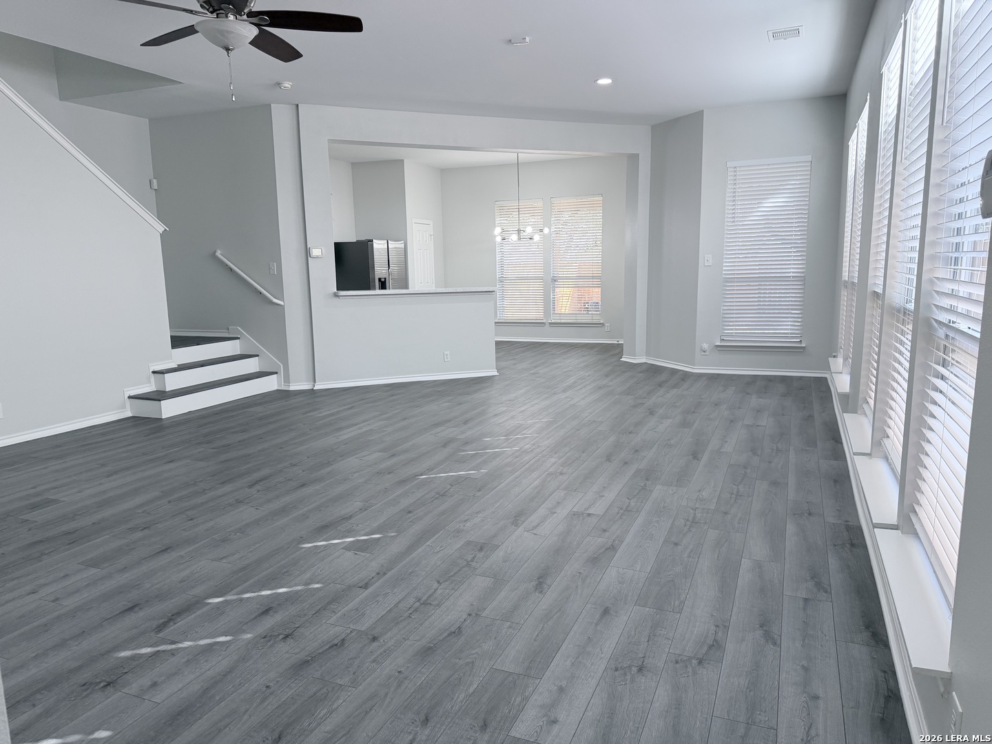 6736 Terra Rye San Antonio, TX 78240 - Photo 4 of 26 wooden floor in an empty room with a window