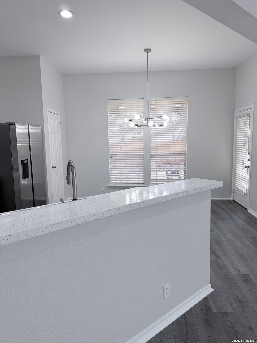 6736 Terra Rye San Antonio, TX 78240 - Photo 6 of 26 a view of a kitchen with a sink and wooden floor