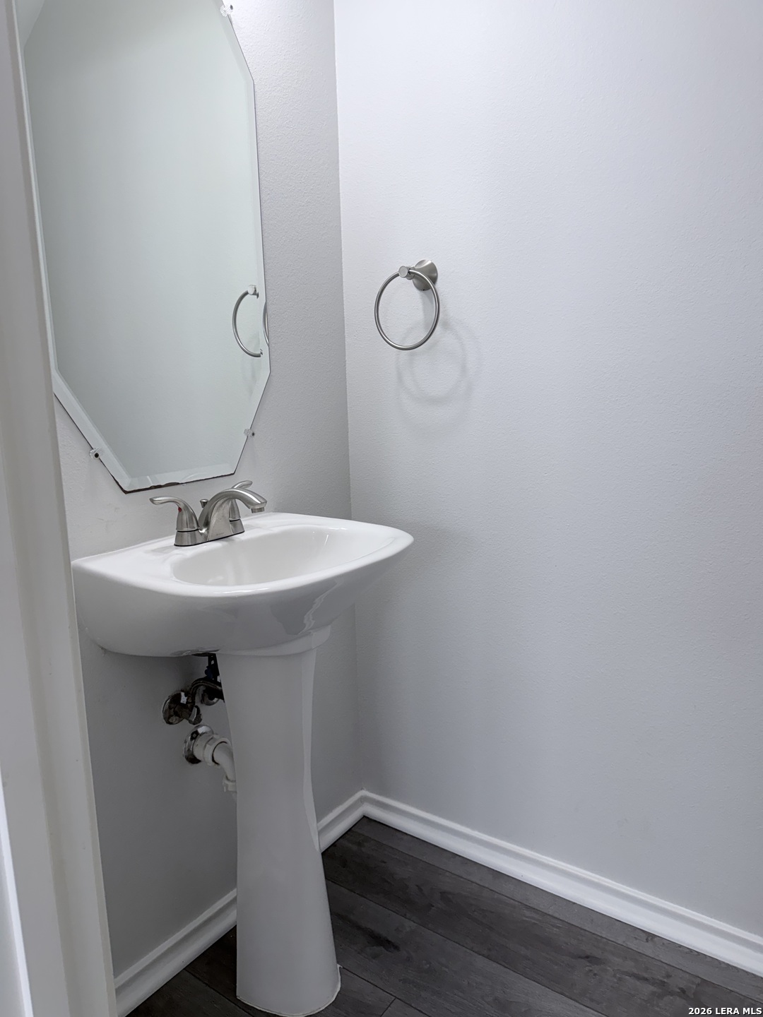 6736 Terra Rye San Antonio, TX 78240 - Photo 7 of 26 a bathroom with a sink and mirror