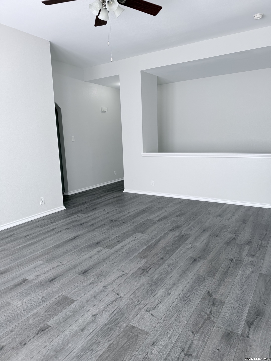 6736 Terra Rye San Antonio, TX 78240 - Photo 10 of 26 a view of an empty room with wooden floor